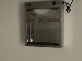 an image of a mirror mounted to the wall of a bathroom