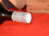 a bottle of wine that is sitting on a table