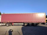 a semi truck that is parked in a parking lot