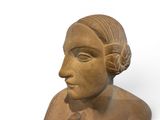 statue of a woman with a flower in her hair on a white background