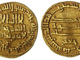 une pièce d'or sur laquelle figure l'image d'un homme