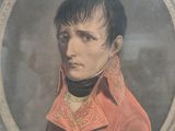 portrait of a young man in a red jacket and black collared shirt