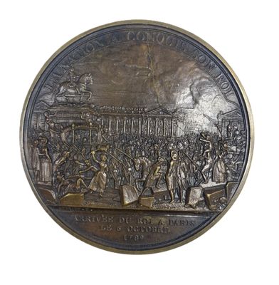 an image of a bronze medal with a picture of a crowd