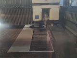a picture of a machine that is working on a piece of metal
