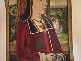 a poster of a woman in a red dress on a wall