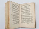 an open book that is sitting on a table