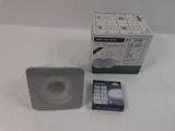 a box with a remote control next to a box with a remote control