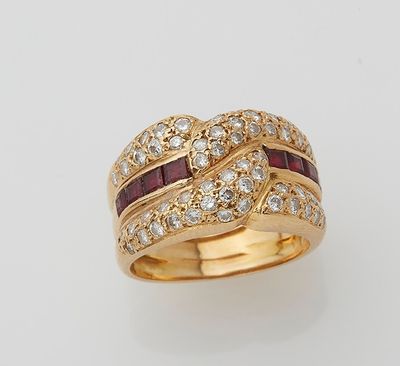 an 18k gold ring set with rubies and diamonds