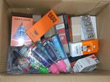 a cardboard box filled with assorted items in it