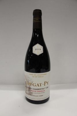 a close up of a bottle of wine on a table