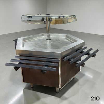 une photo d'une table en acier inoxydable avec un plateau en verre