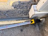 a measuring tape on the side of a building that is under construction