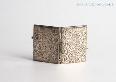 an image of a silver box sitting on top of a white surface
