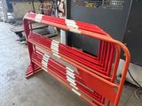 a red and white bench sitting in front of a machine