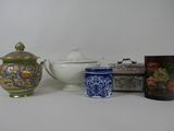 three different types of teapots on a white table