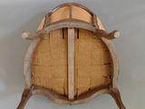 a wooden barrel with a wooden handle on the wall