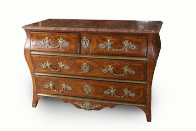 an image of a wooden chest of drawers with a marble top