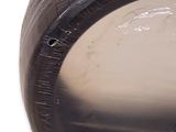 a close up of a tire with a plastic wrap around it