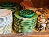 many plates and bowls stacked on top of each other
