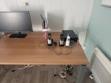 a desk with a computer and a monitor on it