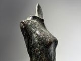 statue of a cat with a pointed tail