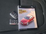 a picture of a picture of a red car and a remote control