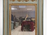 a mirror that is sitting on the floor in a room