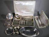 a lot of silverware in a box on a table