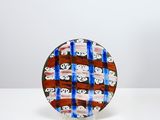 an image of a glass plate with a red, white, and blue design on it
