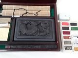 a wooden box with a stamper and a palette in it