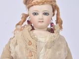 a small doll that is sitting on a table