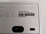 the back of a silver cell phone with a bar code on it