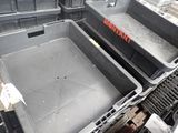 a large metal container that is sitting on the floor