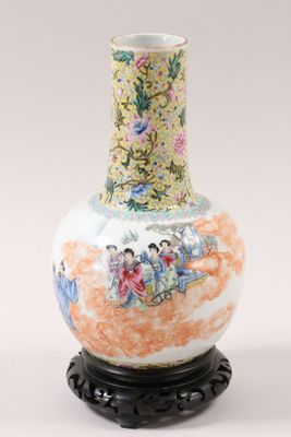 a vase that has a picture of people on it