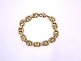 a close up of a gold chain bracelet on a white background