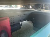 a truck that has a flat bed on it ' s flatbed