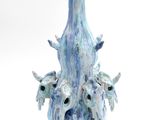 a blue vase that has a bunch of birds on it