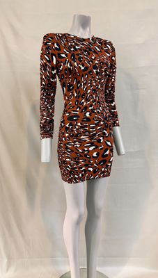 a mannequin wearing a brown and black dress on a white mannequin