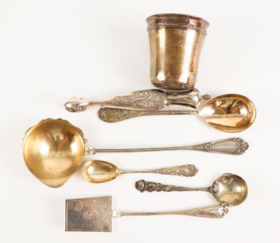 a lot of silver spoons and spoon spoons on a white surface