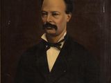 le portrait d'un homme en costume et nœud papillon