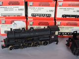 a lot of toy trains that are on a table