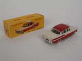 an image of a red and white toy car next to a yellow box
