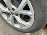 a close up of a tire on a car ' s rim
