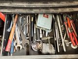 many tools in the drawer of a workbench