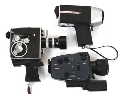 two cameras and a video camera on a white surface