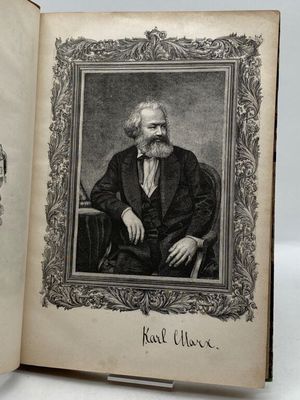 an old book with a picture of a man in a suit and tie