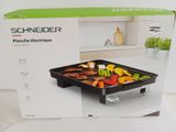 une boîte contenant une grille, posée sur une table