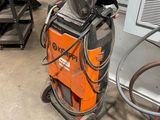 a machine that is sitting on the floor in the garage