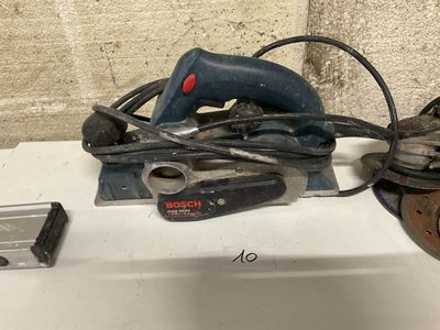 a corded sander sitting on top of a sink