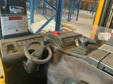 a picture of a forklift driver ' s seat in a warehouse
